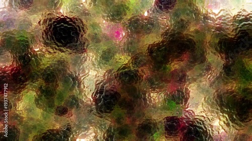 Dynamic abstract motion graphics featuring fluid liquid-like textures flowing across a foggy glass surface with soft blurred floral colors behind it. Dreamy organic movement with vibrant gradients and