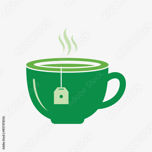 Green tea cup with a tea bag and steam rising from it