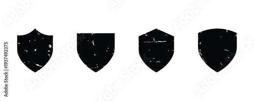 Set of grunge shield icons with textured effect