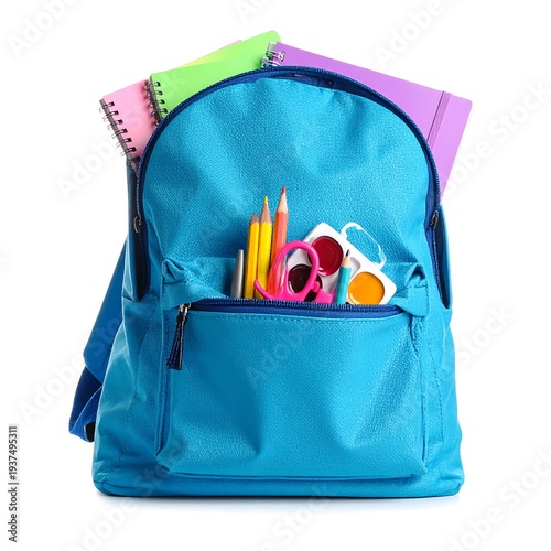 Blue backpack with school supplies on a clean white surface