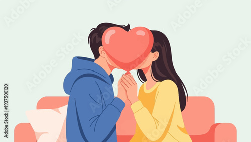 Young couple shares a kiss behind a heart-shaped balloon while holding hands
