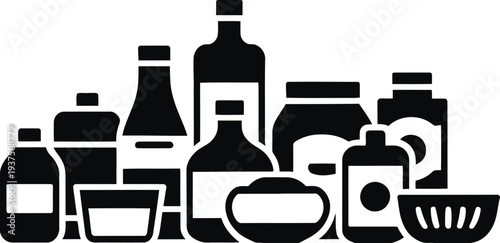 Assortment of bottles and jars representing pantry staples condiments and food storage for kitchen and grocery