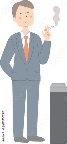 喫煙所でタバコを吸う若い男性会社員