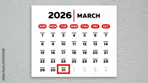 The date March 31st marked with a red cursor on the wall calendar 2026