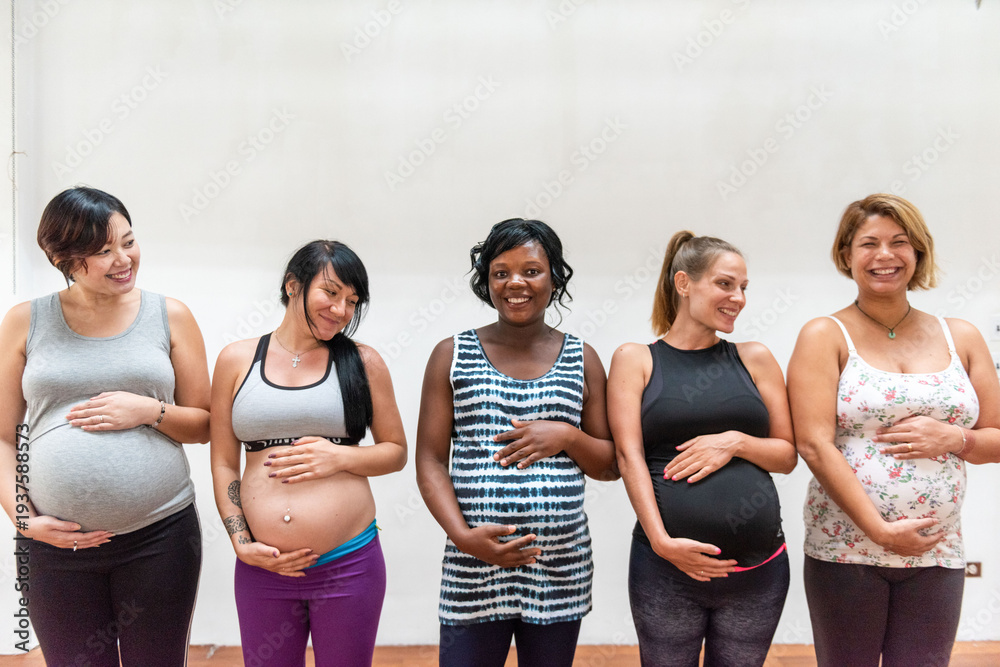 Fototapeta premium Diverse pregnant women smiling together