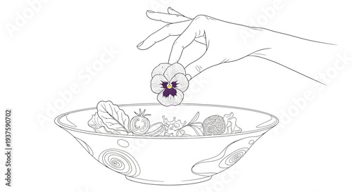 Hand adding edible flower to vibrant salad bowl