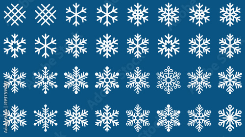 Collection of white snowflakes on a blue background.