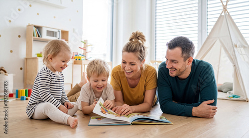 Happy family reading book on floor together, cozy bright living room, playful childhood bonding moment