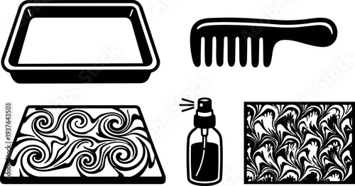 Flat design top view marbling tray with comb and spray bottle creating swirling marbled paper art in black and white