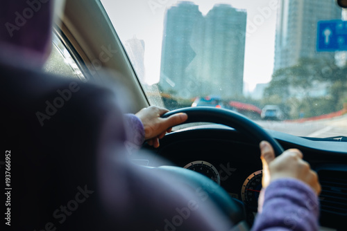 Commuter driving car on the city road
