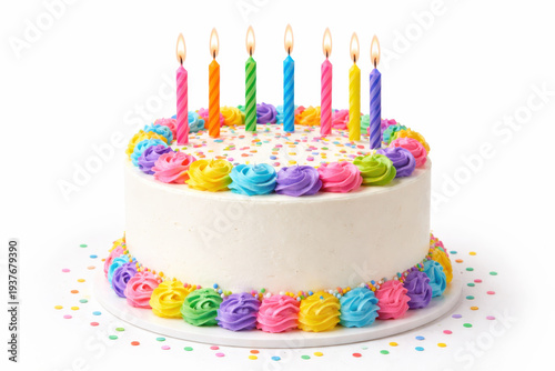 Colorful birthday cake with rainbow candles and icing roses on white background. Festive and cheerful celebration dessert