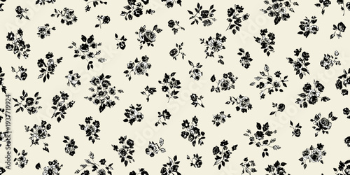 A seamless pattern of delicate black floral designs on a cream background