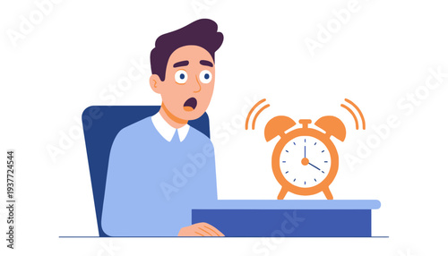 Man sitting at desk shocked by ringing alarm clock