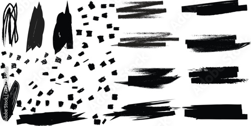 A collection of black ink brush strokes and dots on a white background