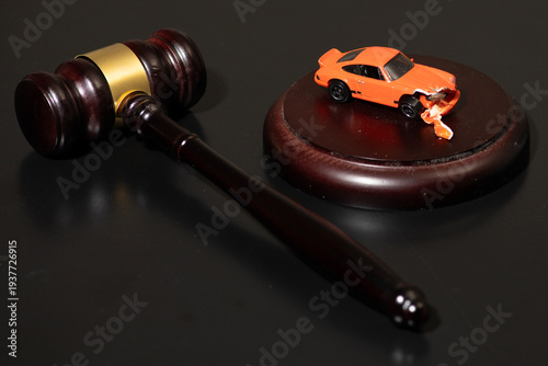 Gavel in traffic court for regulation and enforcement. Car accident in traffic court for DUI or speeding. Gavel for prosecution and investigation in traffic court. Car for injury claim and damages.