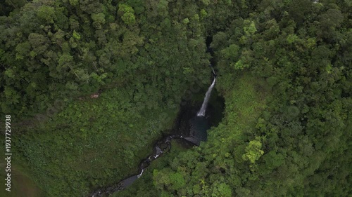 Drone view of Quebrada Gata waterfall in Bajos del Toro Costa Rica in lush jungle rainforest
