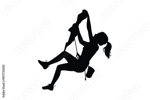 Silhouette of a person rock climbing with ropes outdoor