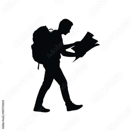 Silhouette of a person with a backpack looking at a map