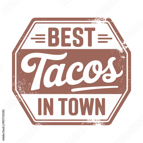 A distressed sign declares best tacos in town with bold lettering