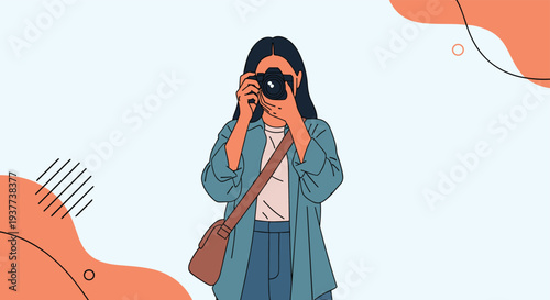 Woman photographer holding a professional camera to her eye against a light blue background with abstract shapes.