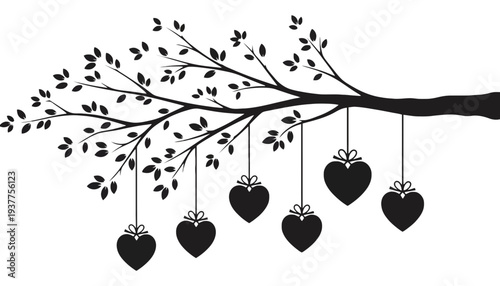 Heart shaped ornaments hanging from a tree branch silhouette