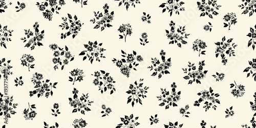 Delicate black floral pattern on a cream colored background texture