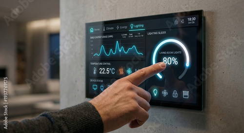 Modern home automation wall panel with touchscreen display controlling energy lighting and climate settings in interior