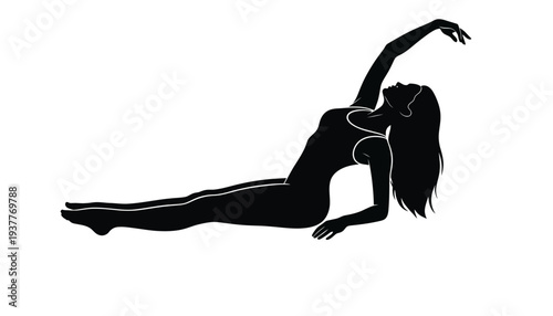 A woman yoga silhouette in a side plank pose with arm raised