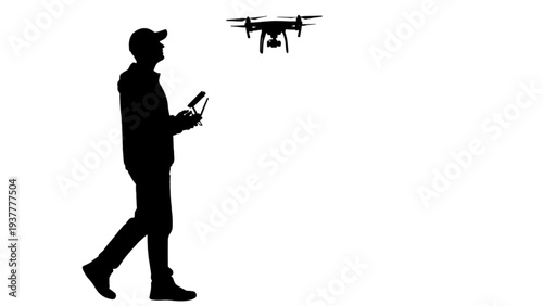 Silhouette of a man in a cap operating a drone with a remote control against a white background