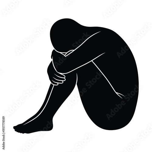 Sad person sitting alone in contemplation and despair