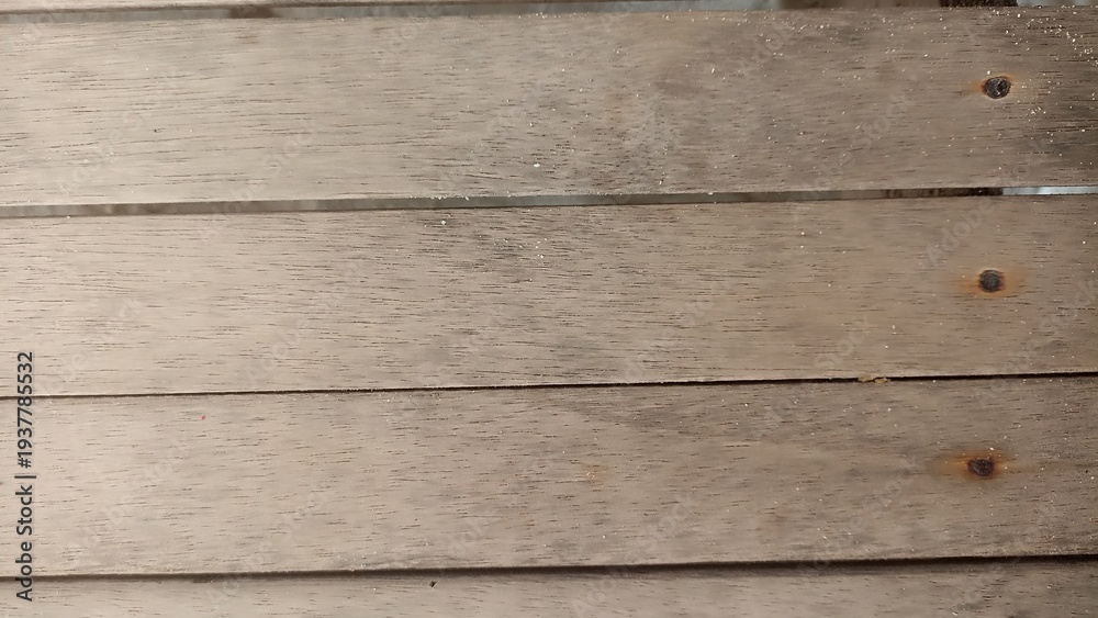 Fototapeta premium Natural Wooden Planks Texture with Visible Screws. Close-up of light wood planks with natural grain and metal screws. Clean rustic background texture