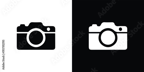 Black and white camera on split color background symbol digital