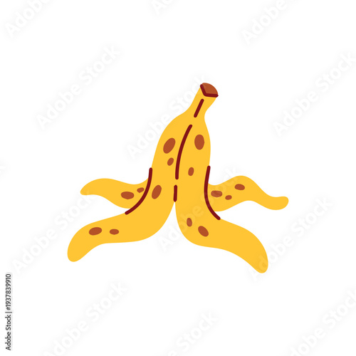 Yellow banana peel discarded on the floor used as a classic slapstick comedy prop for april fools day pranks and safety warning signs. Slippery fruit skin for funny practical jokes