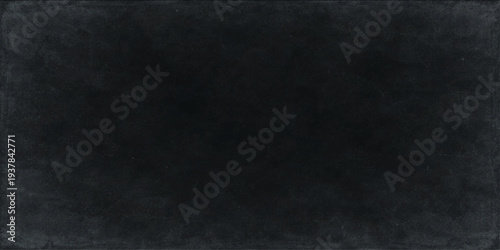 Abstract a close-up, textured study of a blank chalkboard, its dark surface inviting the viewer's imagination and creativity.