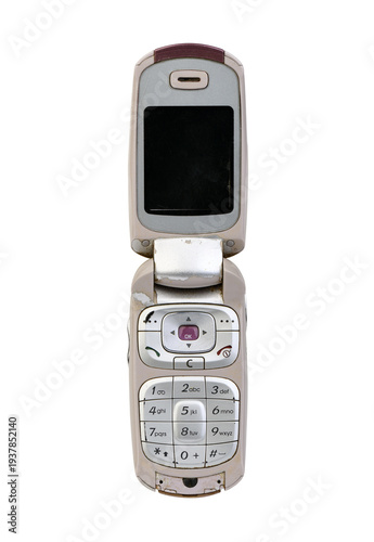 Vintage pink flip phone isolated on white, retro mobile cell phone.