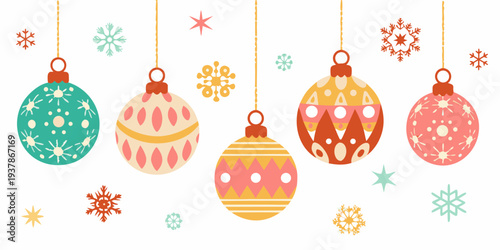 Colorful christmas ornaments and snowflakes hang against a white background
