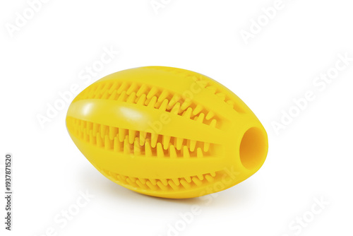 Φωτογραφία Yellow rubber dog toy ball ellipsoid shape with textured ridges and hollow cente