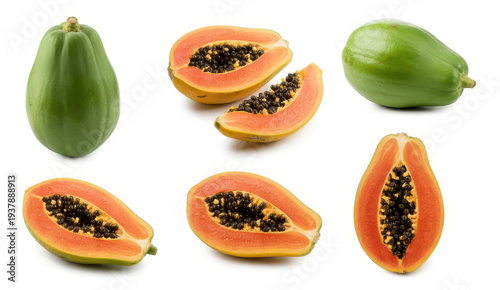 Green and ripe papaya fruits and slices on white background
