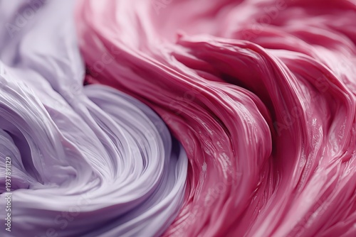A macro view of swirling pink and lavender paint, forming a mesmerizing, abstract design with glossy surfaces and intricate textures, ideal for modern backgrounds.