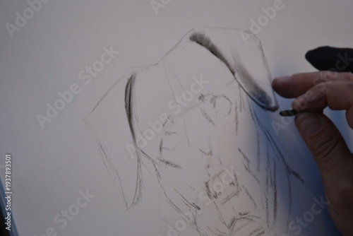 Drawing a dog on a piece of white paper