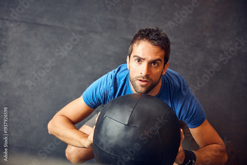 Schilderij op canvas Athlete, man and medicine ball for fitness at gym with exercise, training and coordination