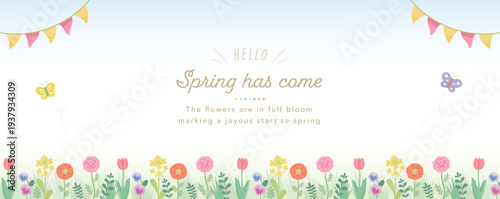 青空を背景にした春のカラフルな花フレーム:チューリップとポピーと菜の花の草花