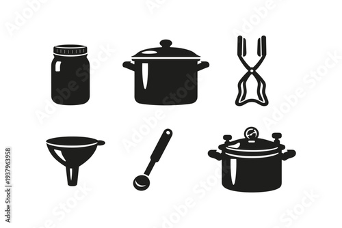 Collection of kitchen tools and canning supplies for food preservation and cooking