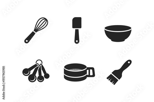 Collection of essential baking tools and utensils for culinary preparation