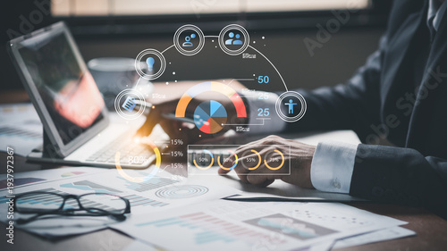 Businessman hands typing on laptop with virtual human resources and target audience demographics data interface