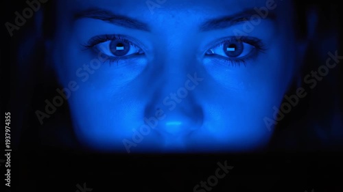 Face Illuminated Laptop Screen Blue Glow Dark Room Macro Cinematic.