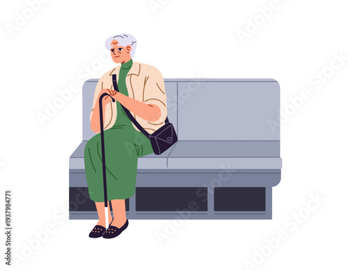 Obraz na plátně Old woman with cane sits on bench in subway train