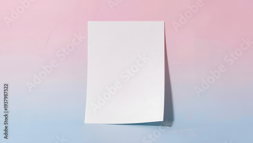 Blank white paper standing on pastel background