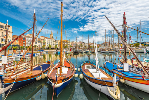 Scenic view of Sanary sur Mer in south of France and its fishermen boats against dramatic summer sky