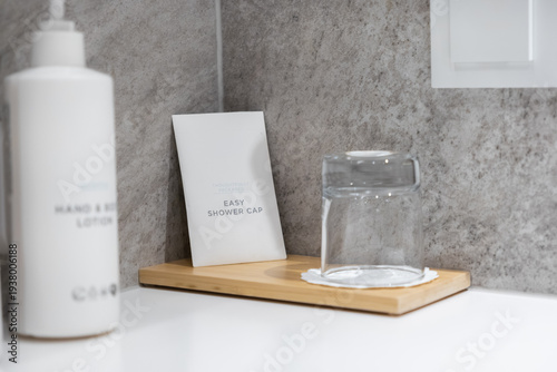 Photos Modern hotel bathroom amenities, featuring a white lotion bottle, Easy Shower Ca